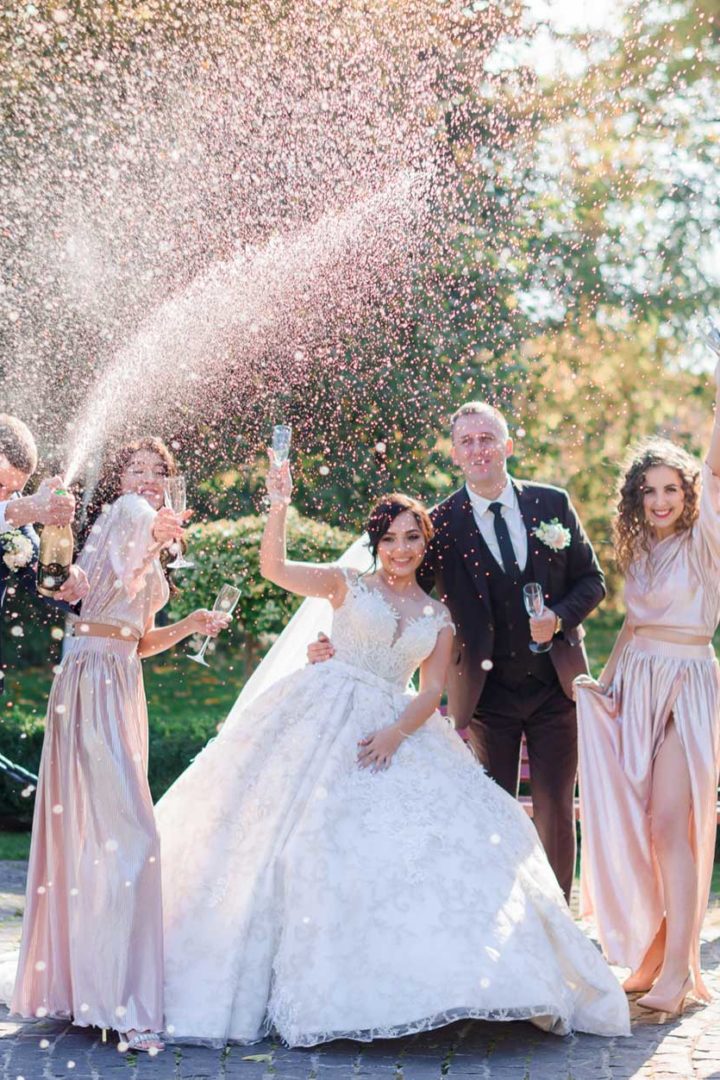wedding-couple-best-friends-are-drinking-champagne-celebrating-park-wedding-day.jpg